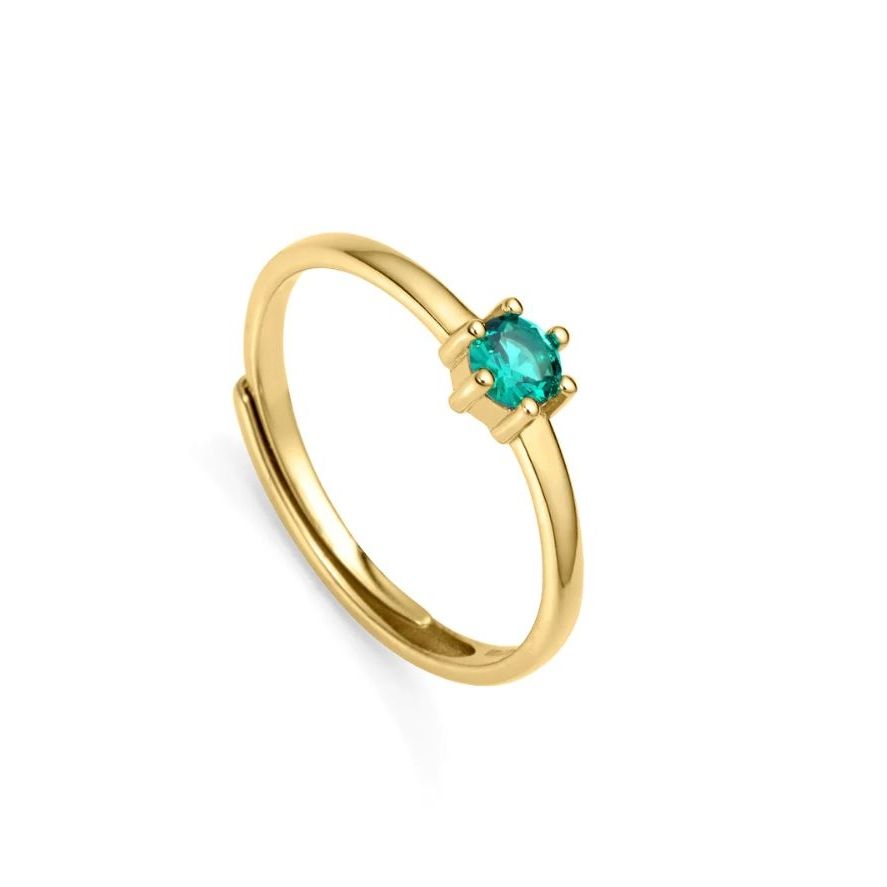 Gold ring with a green gemstone featuring simple elegance.