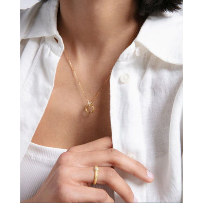 Woman wearing a gold ring and necklace, showcased against a white shirt and top, emphasizing the elegance of VICEROY JEWELS Mod. 9124A016-30.