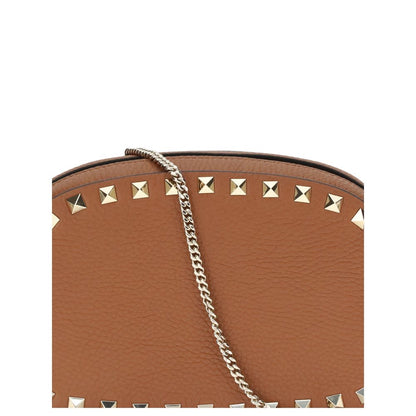 Valentino Garavani Brown Calf Leather Bos Taurus Shoulder Bag with platinum-finish studs and chain detail, AW25 collection.