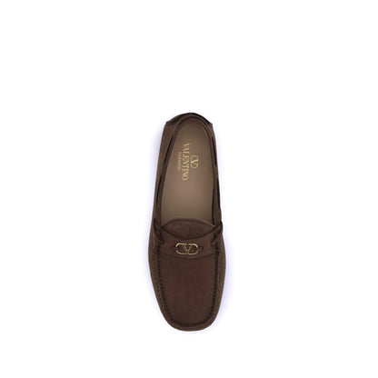 Top view of Valentino Garavani Brown Rubber Slip-On Loafers with VLogo plaque and notched sole for grip.