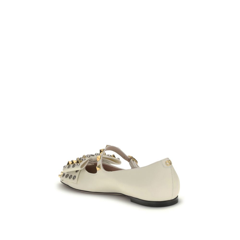 Valentino Garavani Cream Goatskin Ballet Flats with studded and bow embellishments, showcasing the back view and VLogo detail.