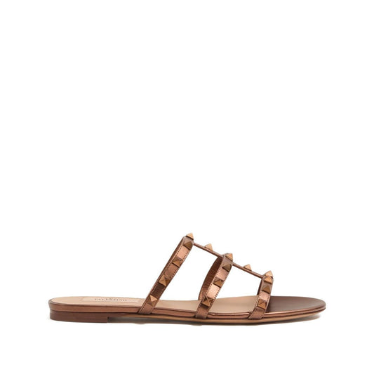 Valentino Garavani Rockstud Low Slide Sandal in Laminated Nappa Leather, brown slip-on with signature studs and branded insole.