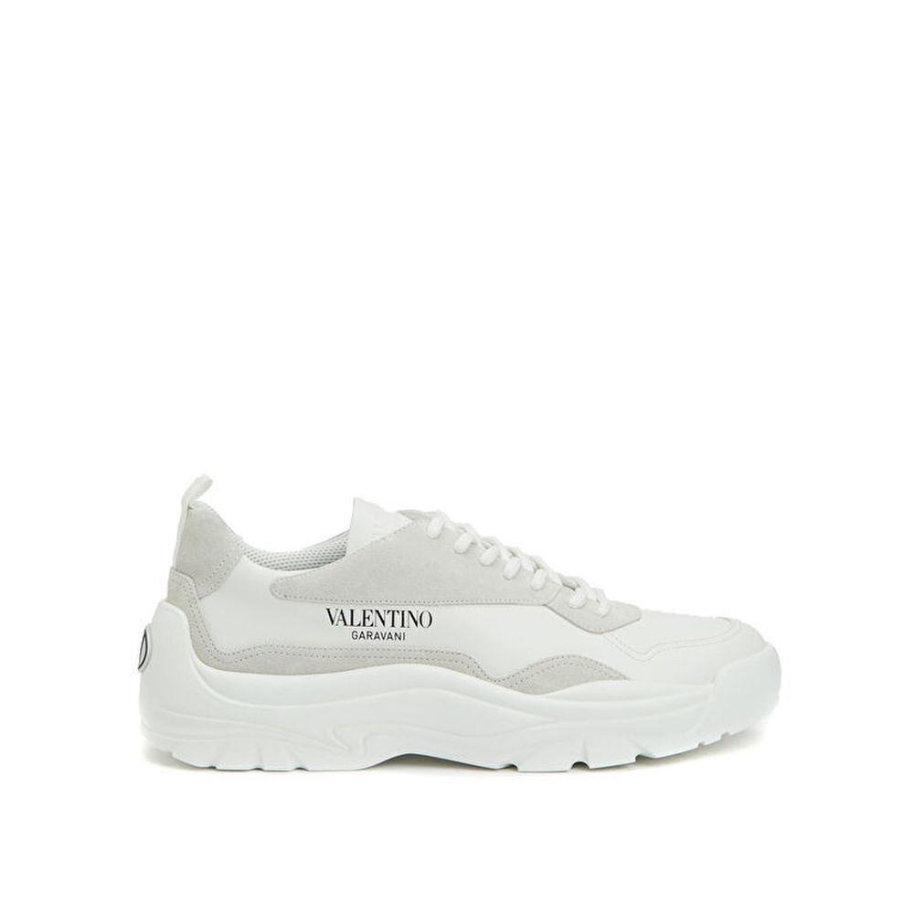 Alt Tag: Valentino Garavani White Leather Low Top Sneakers with suede detail, Italian-made, featuring contrast logo and lace-up fastening.