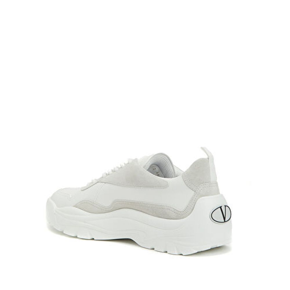 Valentino Garavani White Leather Low Top Sneakers with suede detail, contrast logo, and rubber sole. Men’s shoes made in Italy.