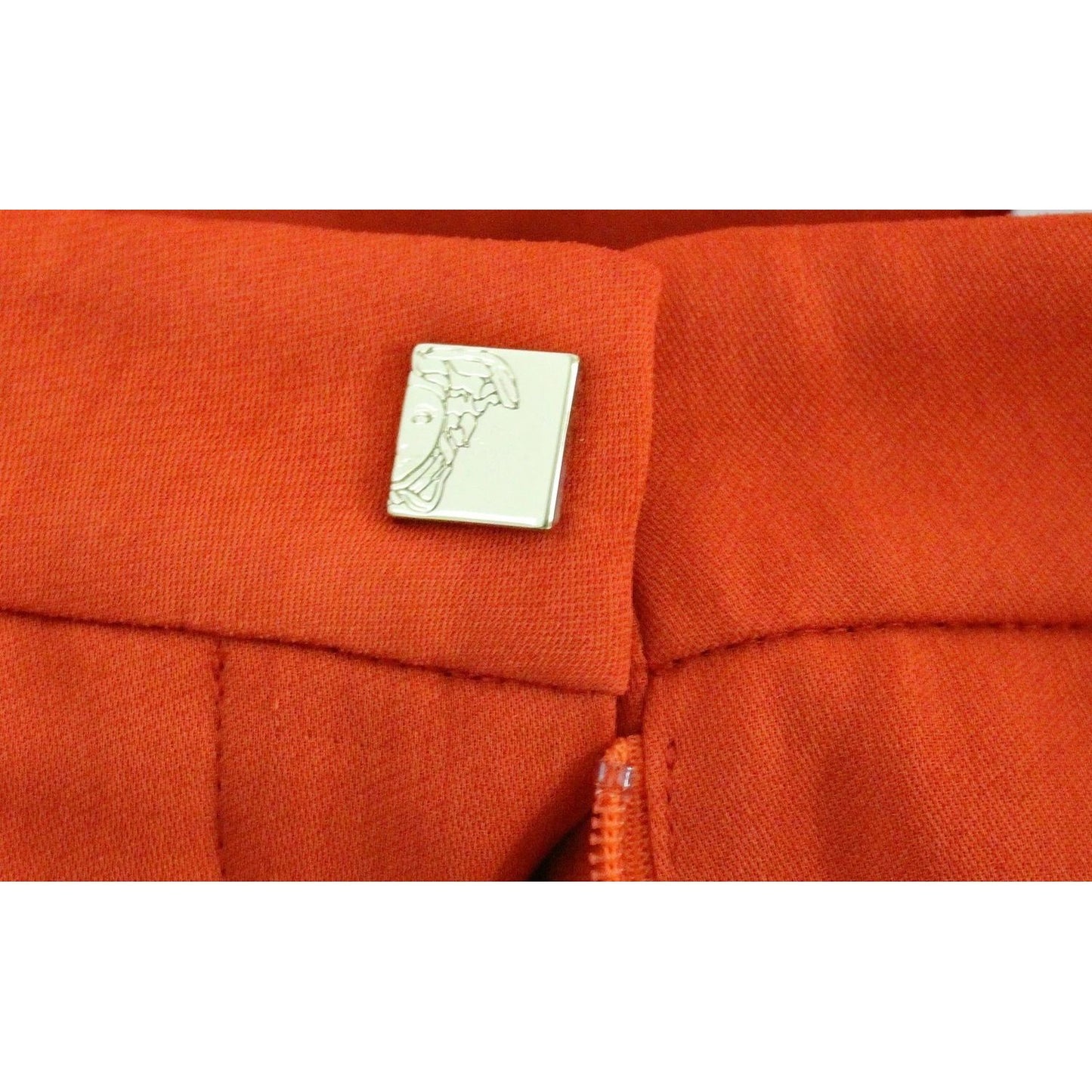 Close-up of Versace Collection Red Pants Cropped 3/4 Short Nude Capri Pants waistband detail with logo button.