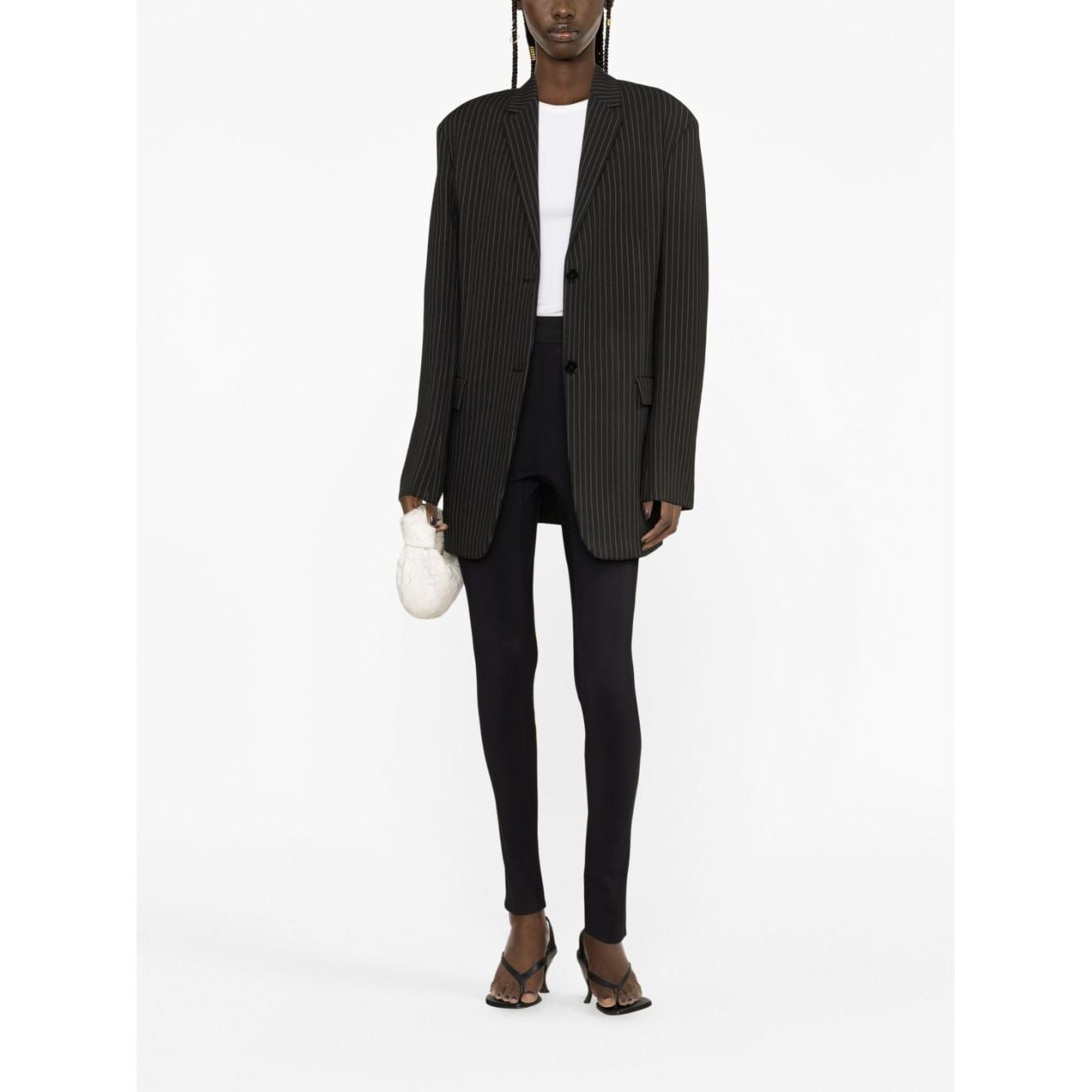 Model wearing WARDROBE.NYC Trousers Black with elasticated waist and rear slit. High waist stretch leggings paired with a blazer.