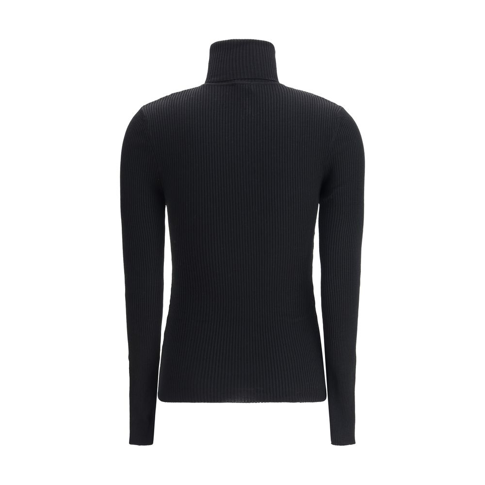 Back view of Wolford Black Fleece Wool Turtleneck, showcasing ribbed texture and slim fit design, perfect for elegant autumn wear.