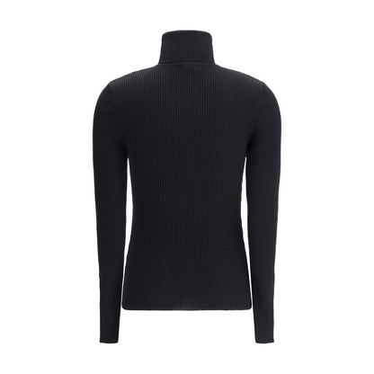 Back view of Wolford Black Fleece Wool Turtleneck, showcasing ribbed texture and slim fit design, perfect for elegant autumn wear.