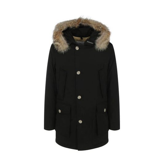 Woolrich Black Cotton Parka with fur hood, featuring patch pockets, ribbed cuffs, and oversized fit, ideal for AW25 season.
