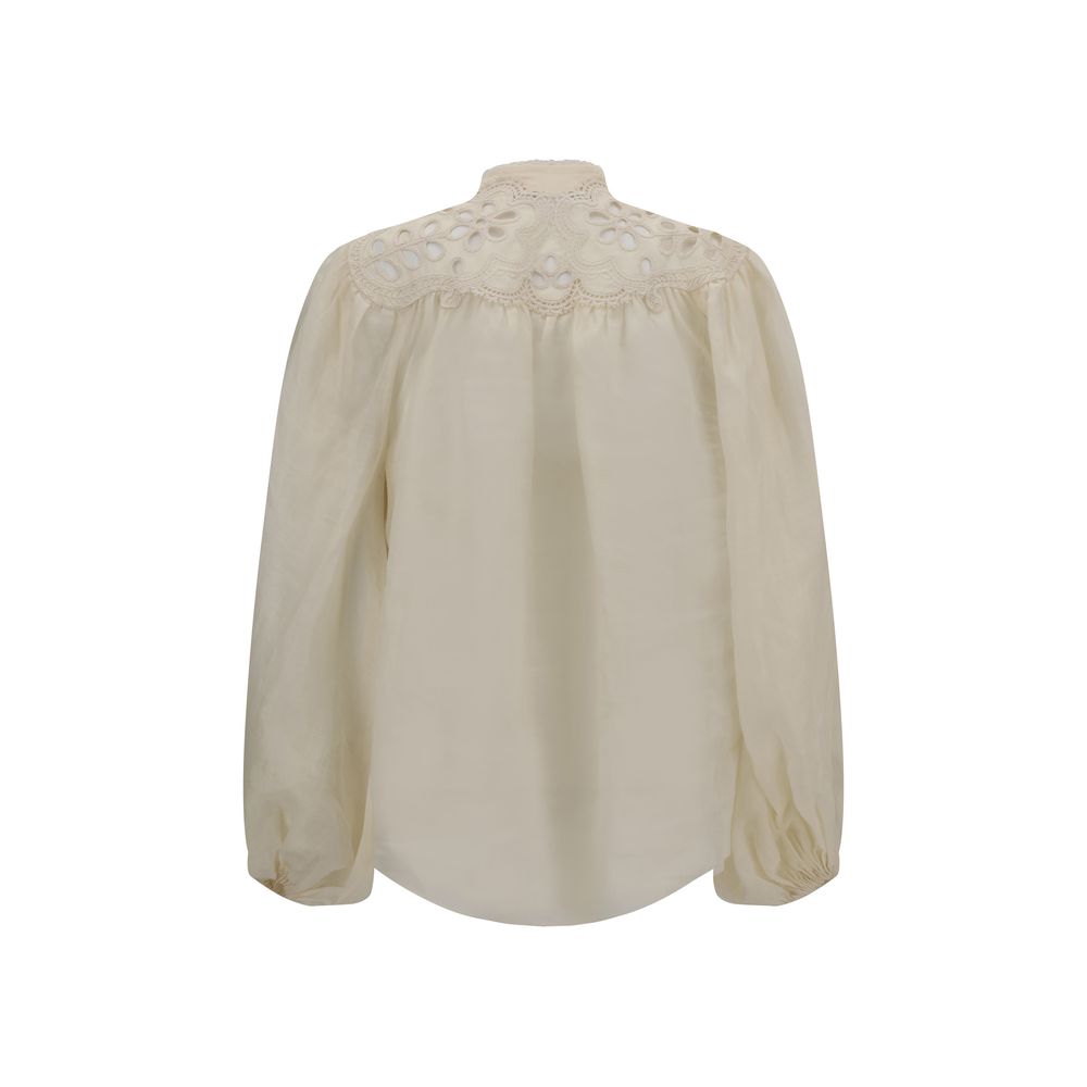 Zimmermann Cream Ramie Blouse with embroidered lace details and puff sleeves viewed from the back.