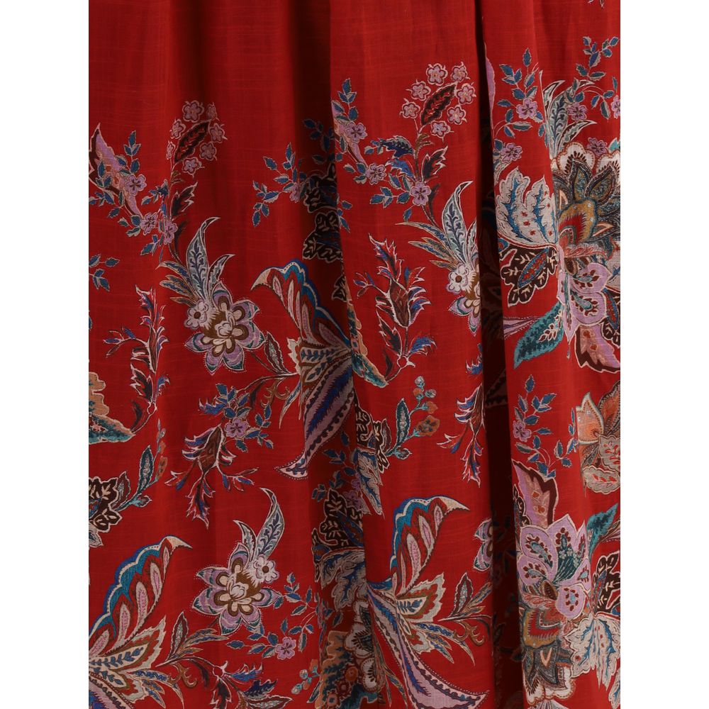 Zimmermann Rhiannon midi Dress detail with delicate floral pattern, showcasing red fabric with blue and white flowers, summer fashion.