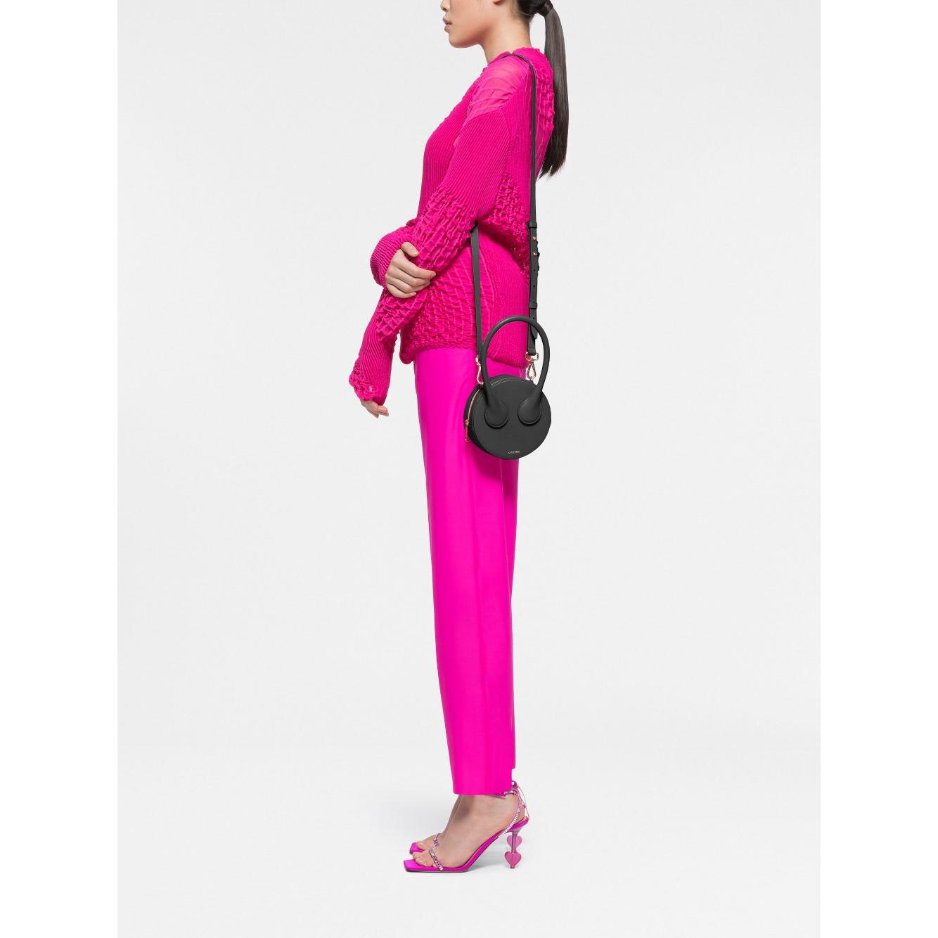 Front view with bag zipped and handles upright.